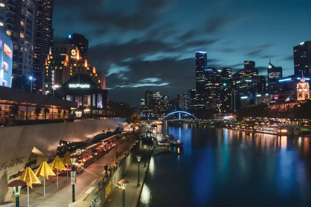 Melbourne's skyline illuminated at night over the Yarra River